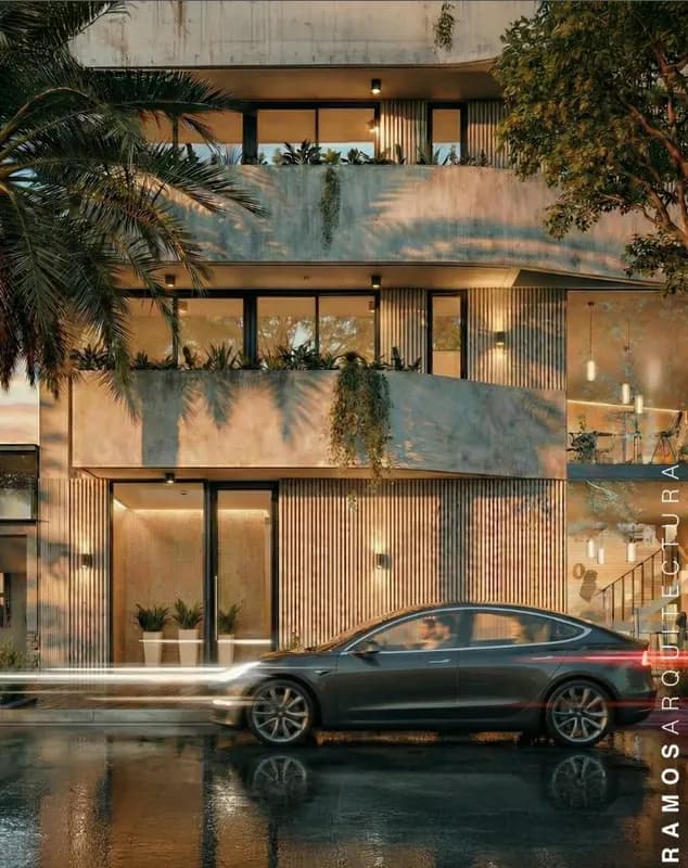 Edificio moderno de hormigón y madera con iluminación nocturna - Ramos Arquitectura